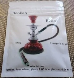 A vibrant, colorful blend of Hookah Herbal Incense in a hookah bowl, surrounded by smoke, offering a calming, nicotine-free aromatic experience