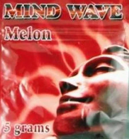 A serene setting showcasing Mind Wave Herbal Incense burning, enveloping the space in a calming aroma while promoting relaxation and focus