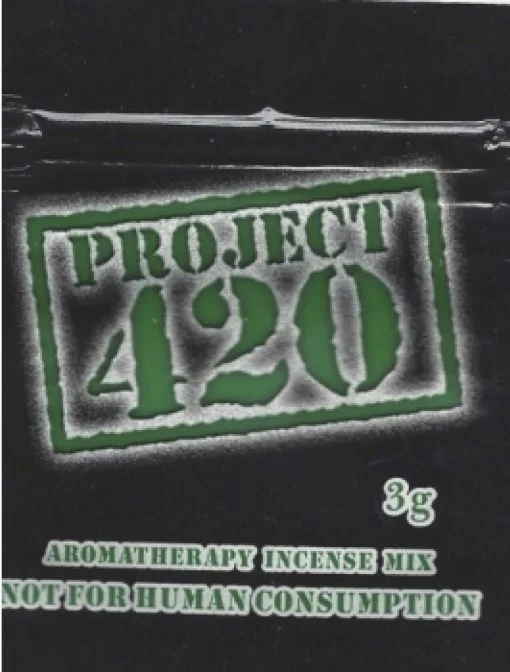 A beautifully crafted stick of Project 420 Herbal Incense burning in a decorative holder, filling the room with its soothing aroma